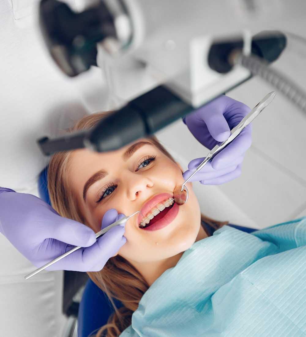 Beautiful lady in the dentist's office. Woman in a uniform